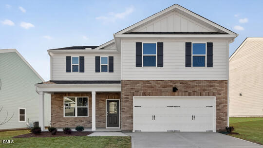 824 Comice Pear Way Willow Spring, NC 27592 - Photo 1 of 43 a front view of a house with a yard