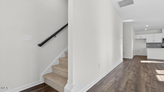 824 Comice Pear Way Willow Spring, NC 27592 - Photo 19 of 43 a view of a hallway with wooden floor and entryway