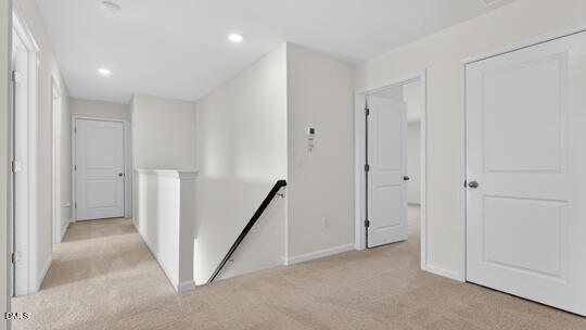 824 Comice Pear Way Willow Spring, NC 27592 - Photo 20 of 43 a view of hallway with stairs