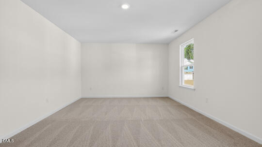 824 Comice Pear Way Willow Spring, NC 27592 - Photo 24 of 43 an empty room with a window