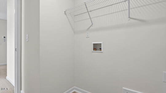824 Comice Pear Way Willow Spring, NC 27592 - Photo 36 of 43 a view of a rack on the wall