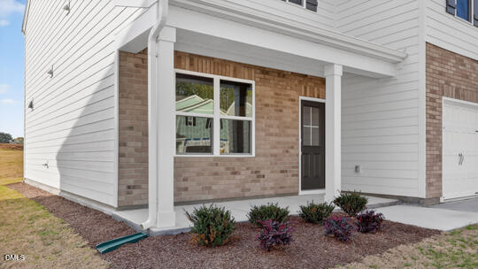 824 Comice Pear Way Willow Spring, NC 27592 - Photo 4 of 43 a view of a entryway front of house