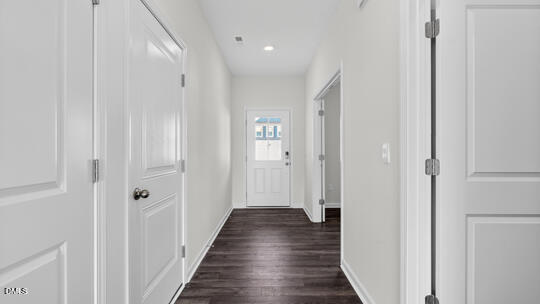 824 Comice Pear Way Willow Spring, NC 27592 - Photo 6 of 43 a view of a hallway with wooden floor