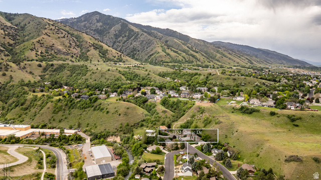 1552 Sumac Drive Logan, UT 84321 - Photo 66 of 72 Property situated within a mountain landscape, featuring residential structures and extensive green hillsides