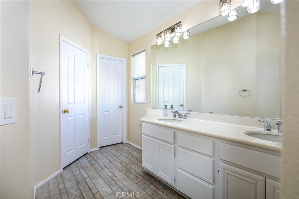 1 Quebec Aliso Viejo, CA 92656 - Photo 16 of 40 a bathroom with a double vanity sink and mirror