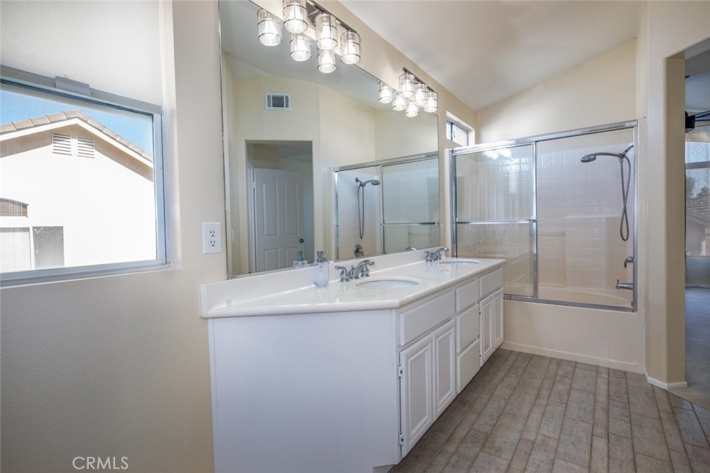 1 Quebec Aliso Viejo, CA 92656 - Photo 17 of 40 a bathroom with a double vanity sink a toilet and a mirror