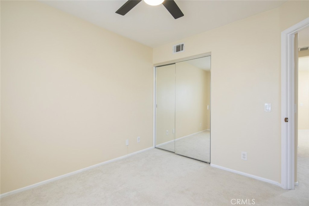 1 Quebec Aliso Viejo, CA 92656 - Photo 20 of 40 an empty room with closet and chandelier fan