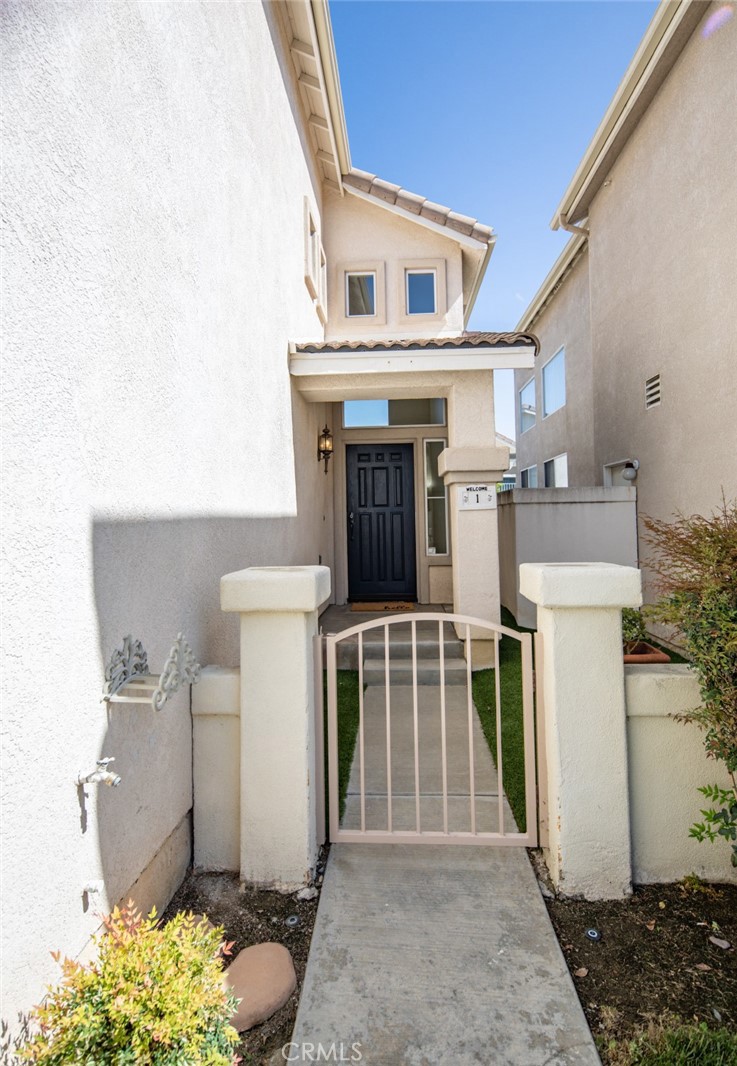 1 Quebec Aliso Viejo, CA 92656 - Photo 2 of 40 a front view of a house with a garage