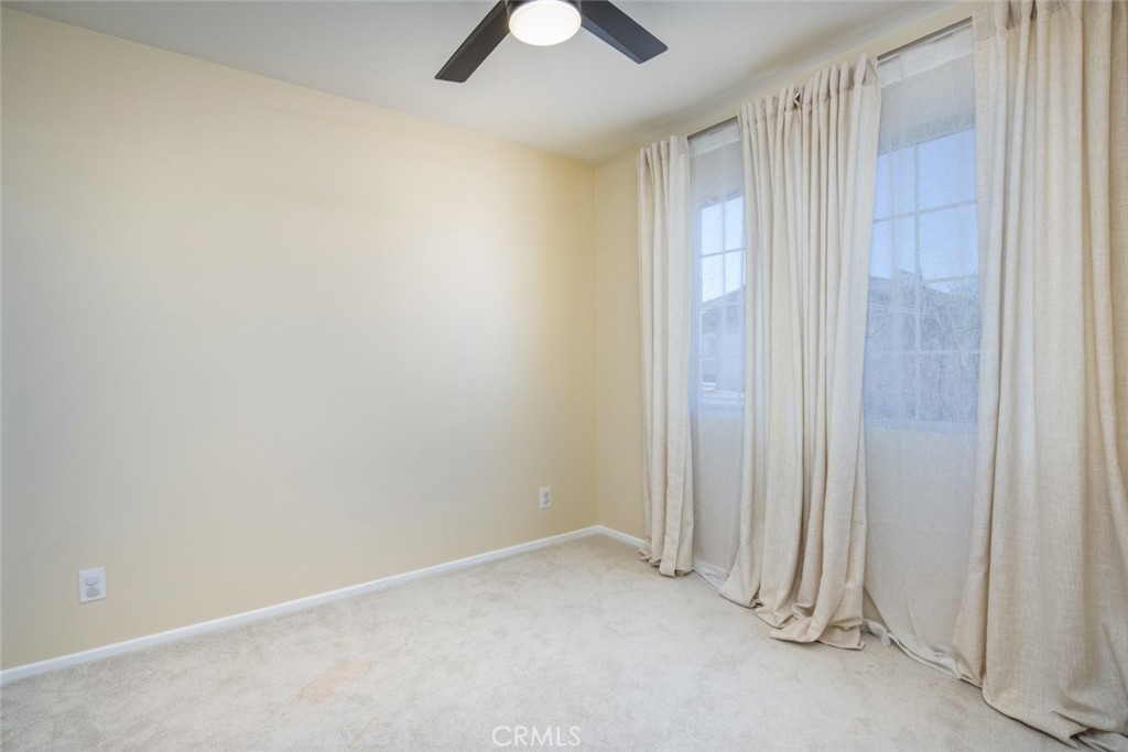 1 Quebec Aliso Viejo, CA 92656 - Photo 21 of 40 an empty room with chandelier fan