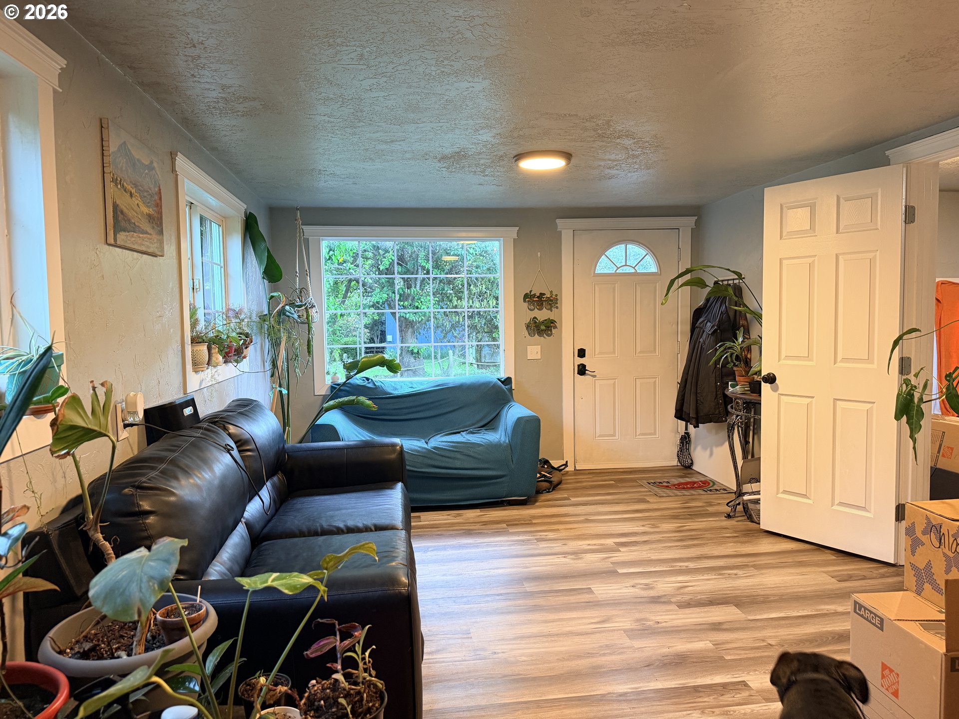 677 Southeast Moffitt Road Waldport, OR 97394 - Photo 9 of 36 a living room with furniture and a large window