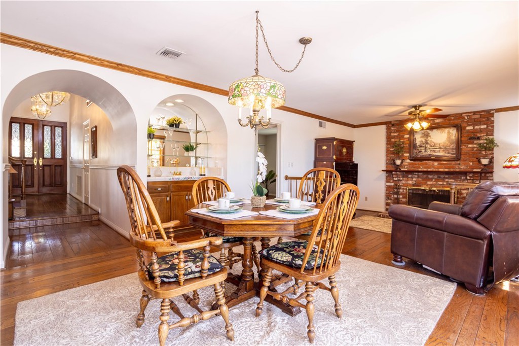 18924 Granada Circle Porter Ranch, CA 91326 - Photo 14 of 45 a view of a dining room with furniture wooden floor and chandelier