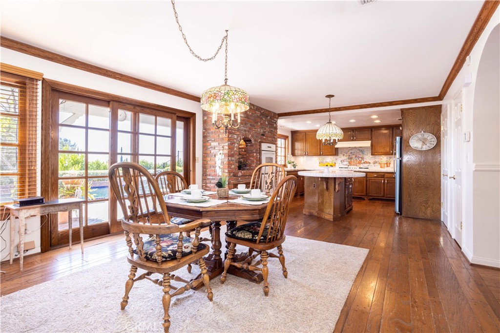 18924 Granada Circle Porter Ranch, CA 91326 - Photo 15 of 45 a view of a dining room with furniture window and wooden floor