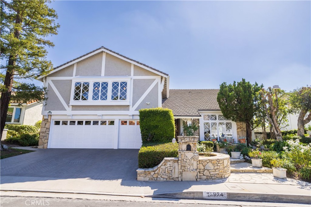 18924 Granada Circle Porter Ranch, CA 91326 - Photo 2 of 45 a front view of a house with garden