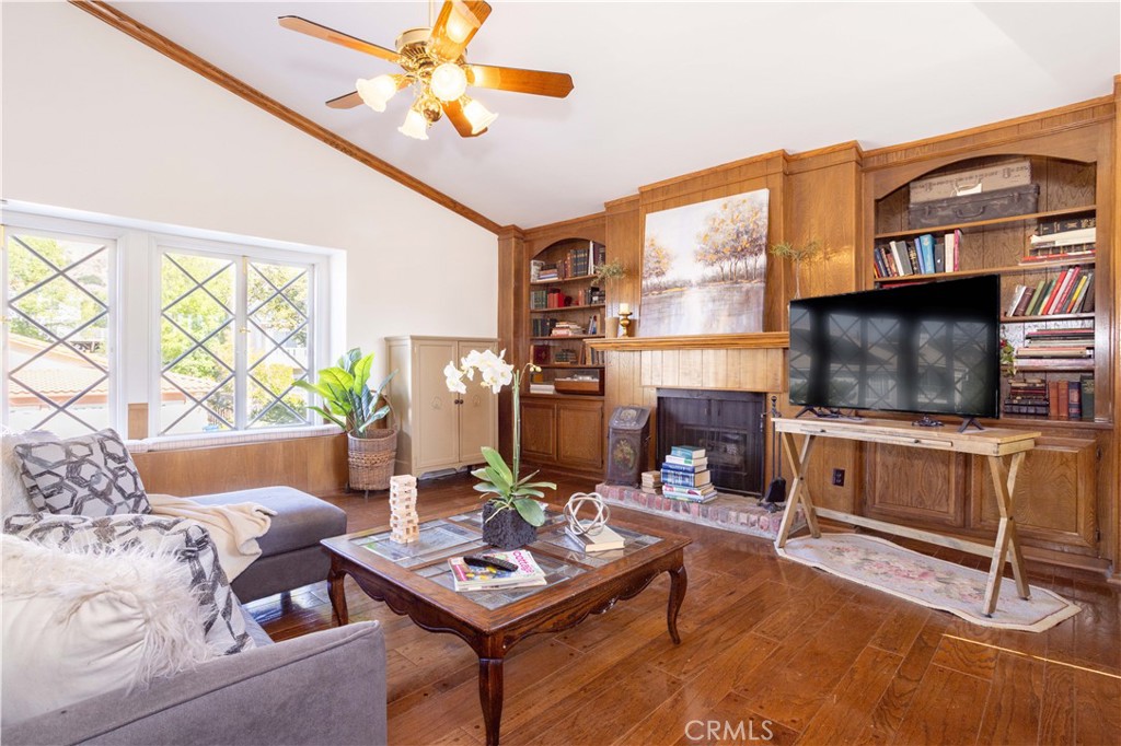 18924 Granada Circle Porter Ranch, CA 91326 - Photo 21 of 45 a living room with furniture a flat screen tv and a large window