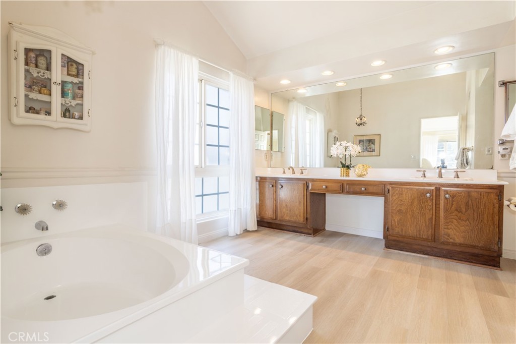 18924 Granada Circle Porter Ranch, CA 91326 - Photo 27 of 45 a large kitchen with a sink a window and stainless steel appliances