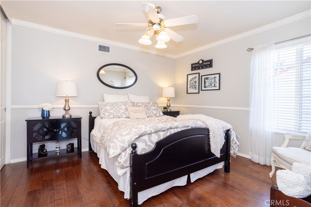 18924 Granada Circle Porter Ranch, CA 91326 - Photo 30 of 45 a bedroom with a bed and a chandelier