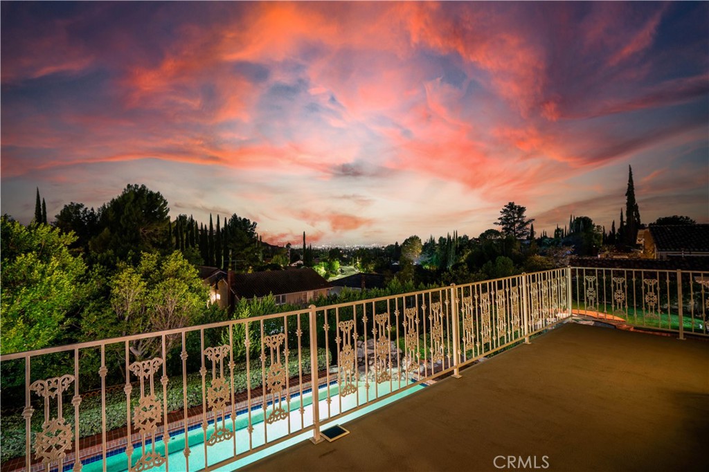 18924 Granada Circle Porter Ranch, CA 91326 - Photo 3 of 45 a view of balcony with two chairs and wooden fence