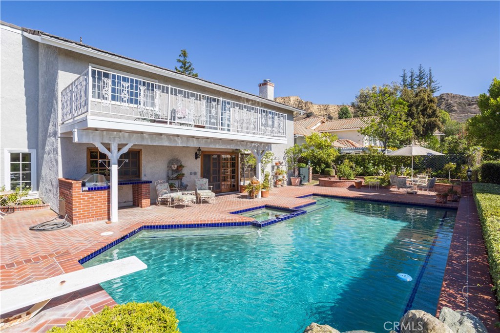18924 Granada Circle Porter Ranch, CA 91326 - Photo 35 of 45 a view of a house with swimming pool and sitting area