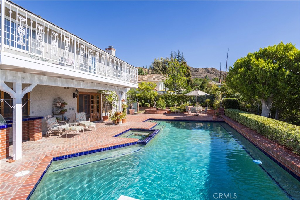 18924 Granada Circle Porter Ranch, CA 91326 - Photo 36 of 45 a view of a house with swimming pool and sitting area
