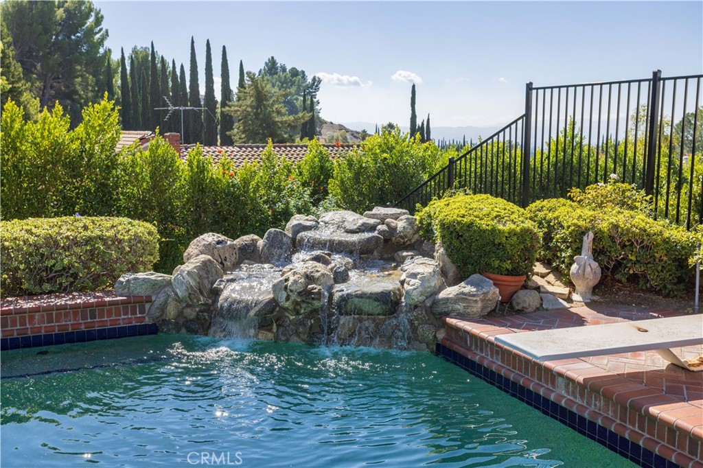 18924 Granada Circle Porter Ranch, CA 91326 - Photo 37 of 45 a view of a backyard with plants and outdoor seating