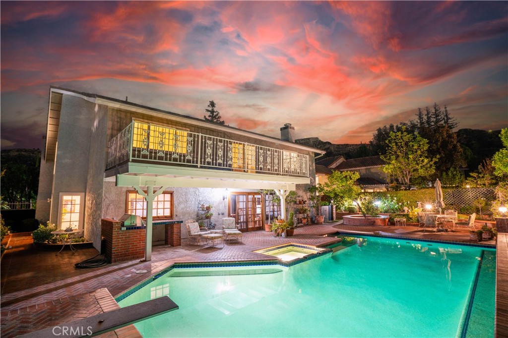 18924 Granada Circle Porter Ranch, CA 91326 - Photo 4 of 45 a view of a house with a swimming pool