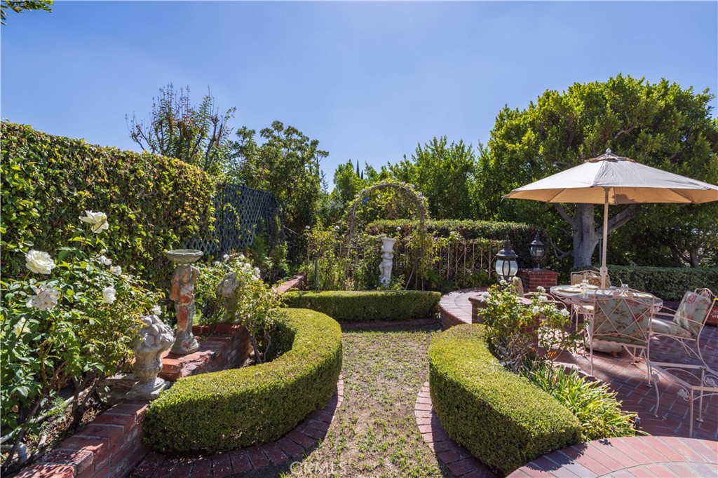 18924 Granada Circle Porter Ranch, CA 91326 - Photo 43 of 45 a view of a patio with couches plants and swimming pool