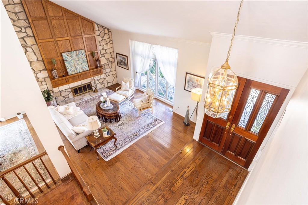 18924 Granada Circle Porter Ranch, CA 91326 - Photo 7 of 45 a living room with furniture and a wooden floor