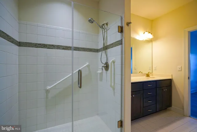 a bathroom with a shower and a sink