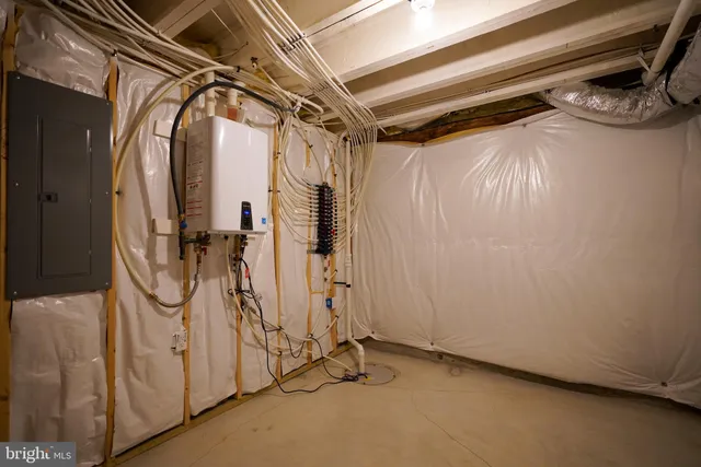 a view of walk in closet with clothes