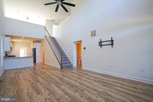 a view of an entryway with wooden floor