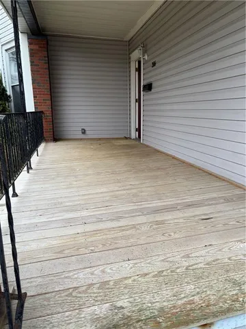 a view of a backyard with large trees