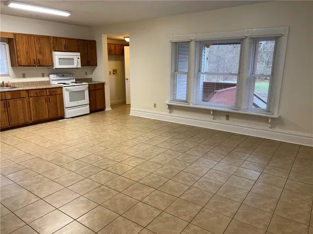 a kitchen with stainless steel appliances a sink and cabinets