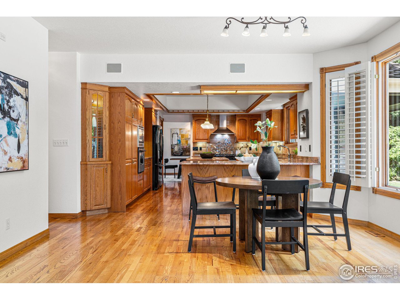 6968 Springhill Drive Niwot, CO 80503 - Photo 11 of 40 a view of a dining area with furniture window and wooden floor