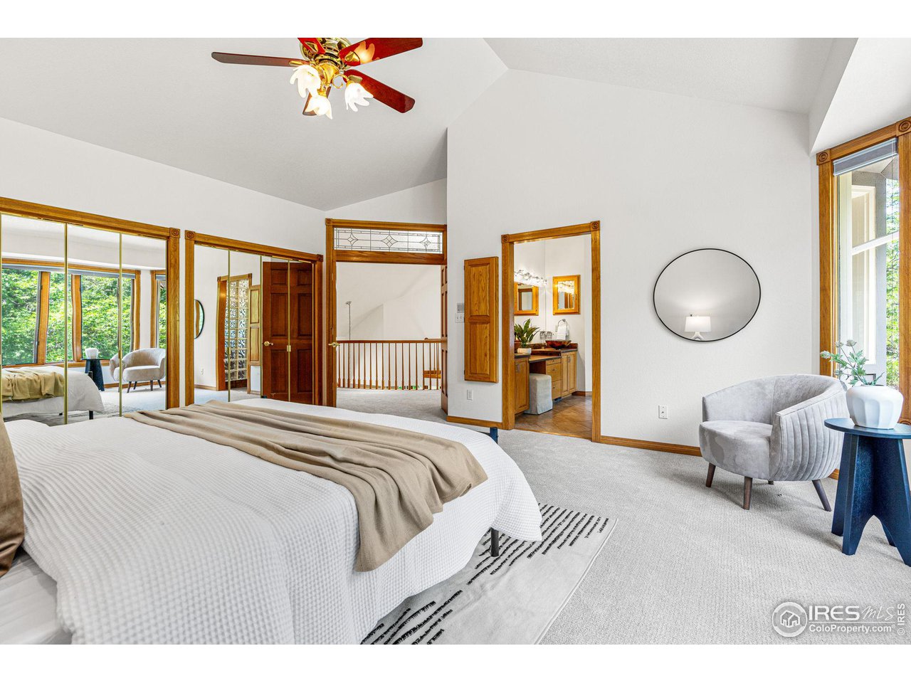 6968 Springhill Drive Niwot, CO 80503 - Photo 18 of 40 a bedroom with a large bed and a large window