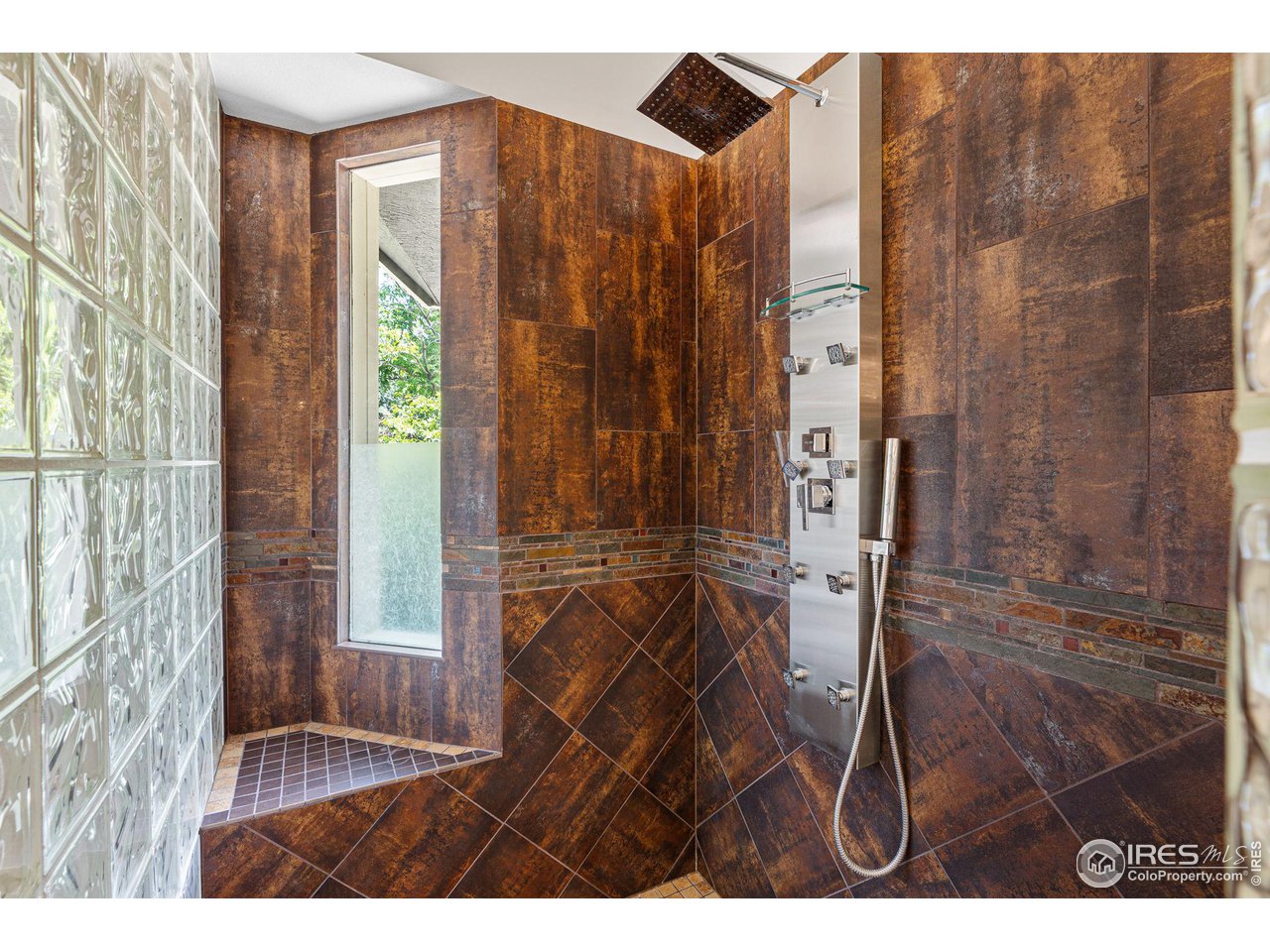6968 Springhill Drive Niwot, CO 80503 - Photo 21 of 40 a bathroom with a shower and a sink