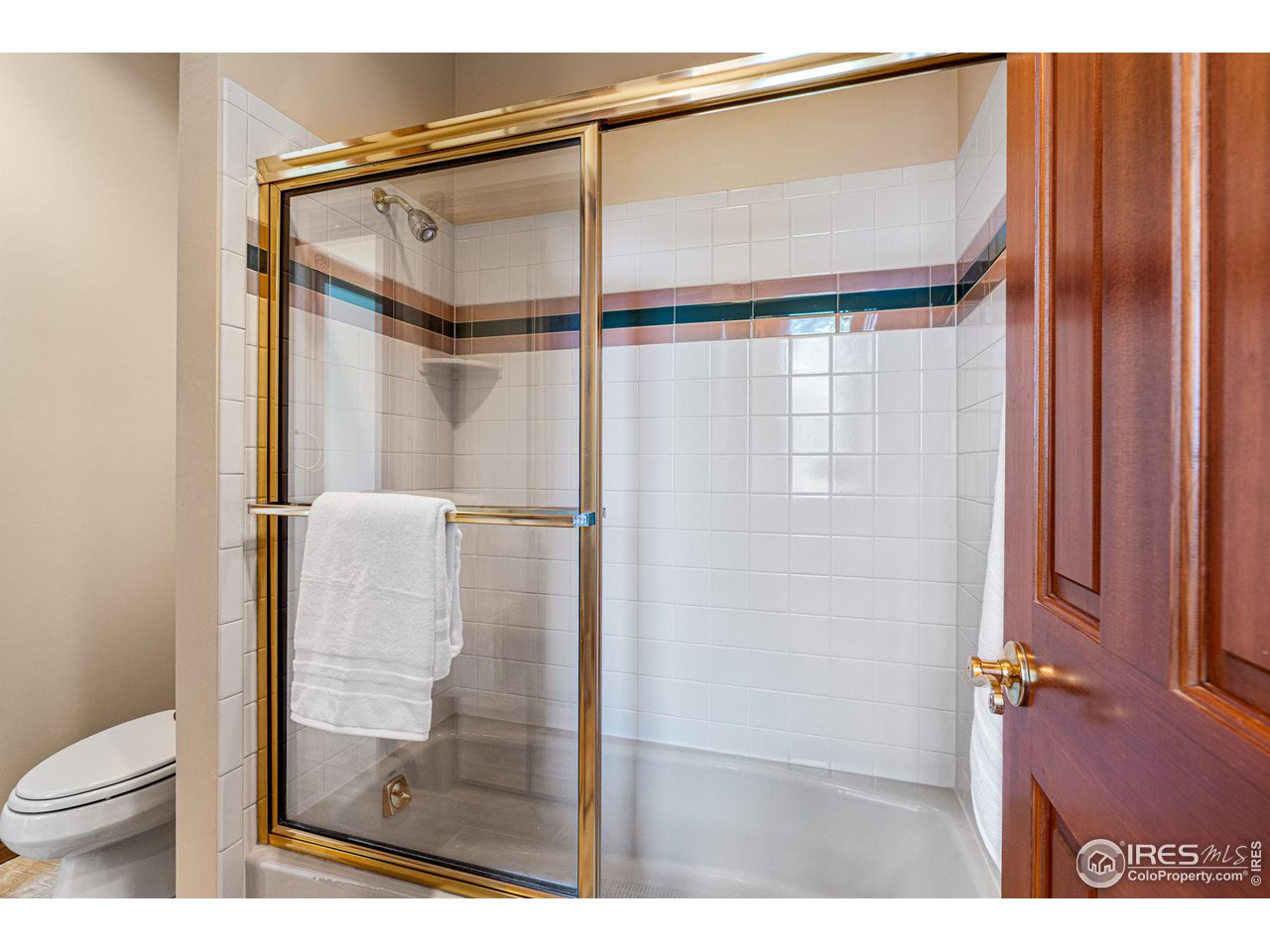 6968 Springhill Drive Niwot, CO 80503 - Photo 25 of 40 a bathroom with a shower and a toilet