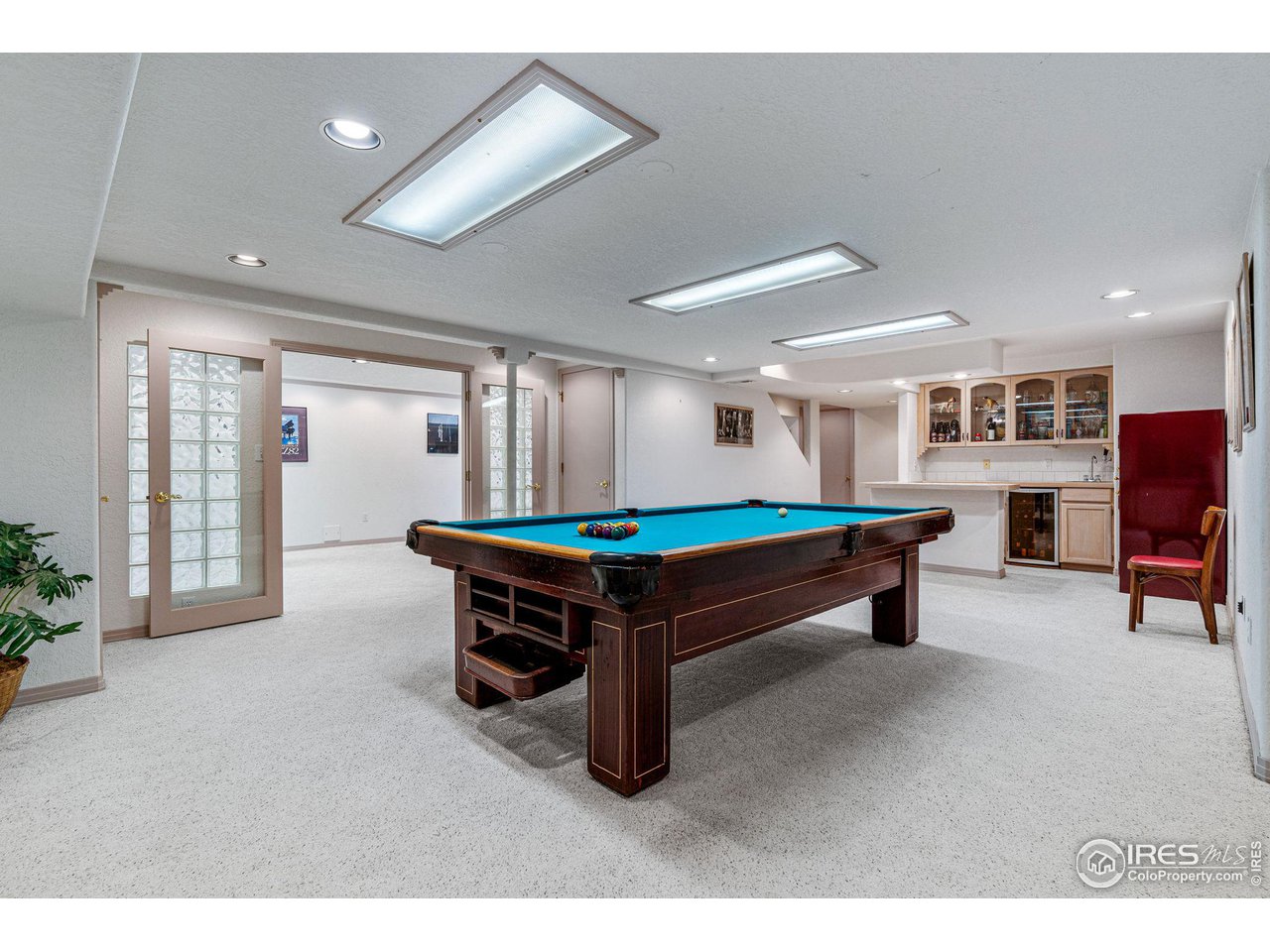 6968 Springhill Drive Niwot, CO 80503 - Photo 27 of 40 a room with wooden furniture and wooden floors