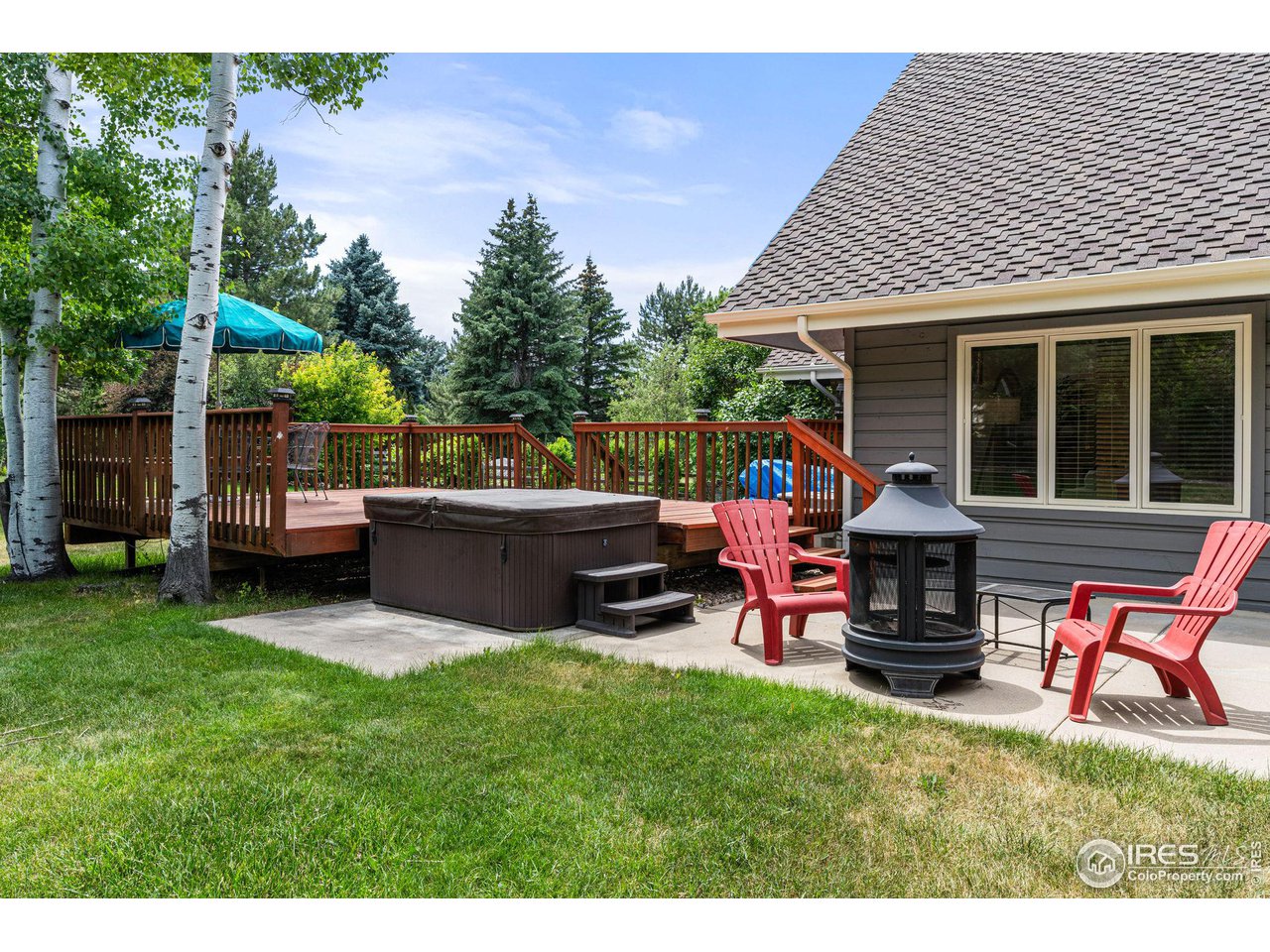 6968 Springhill Drive Niwot, CO 80503 - Photo 33 of 40 a view of a house with a backyard and sitting area