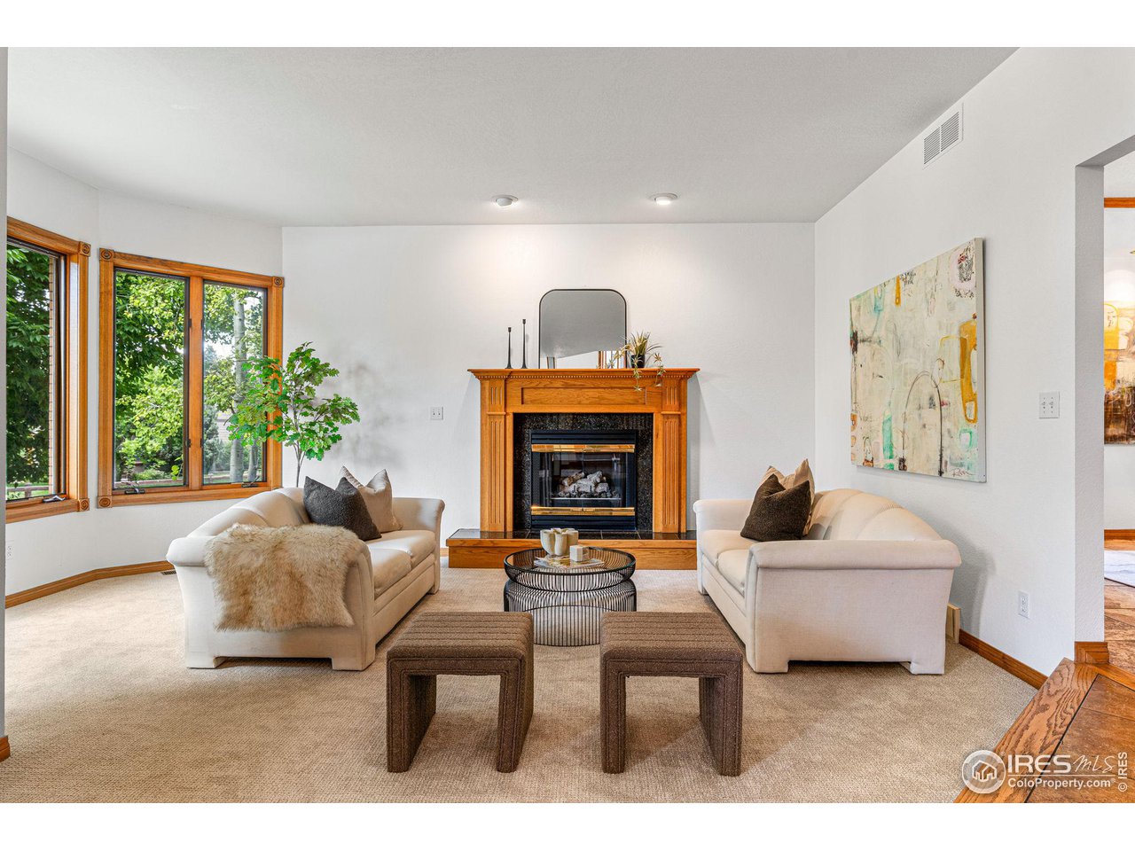 6968 Springhill Drive Niwot, CO 80503 - Photo 4 of 40 a living room with furniture and a fireplace