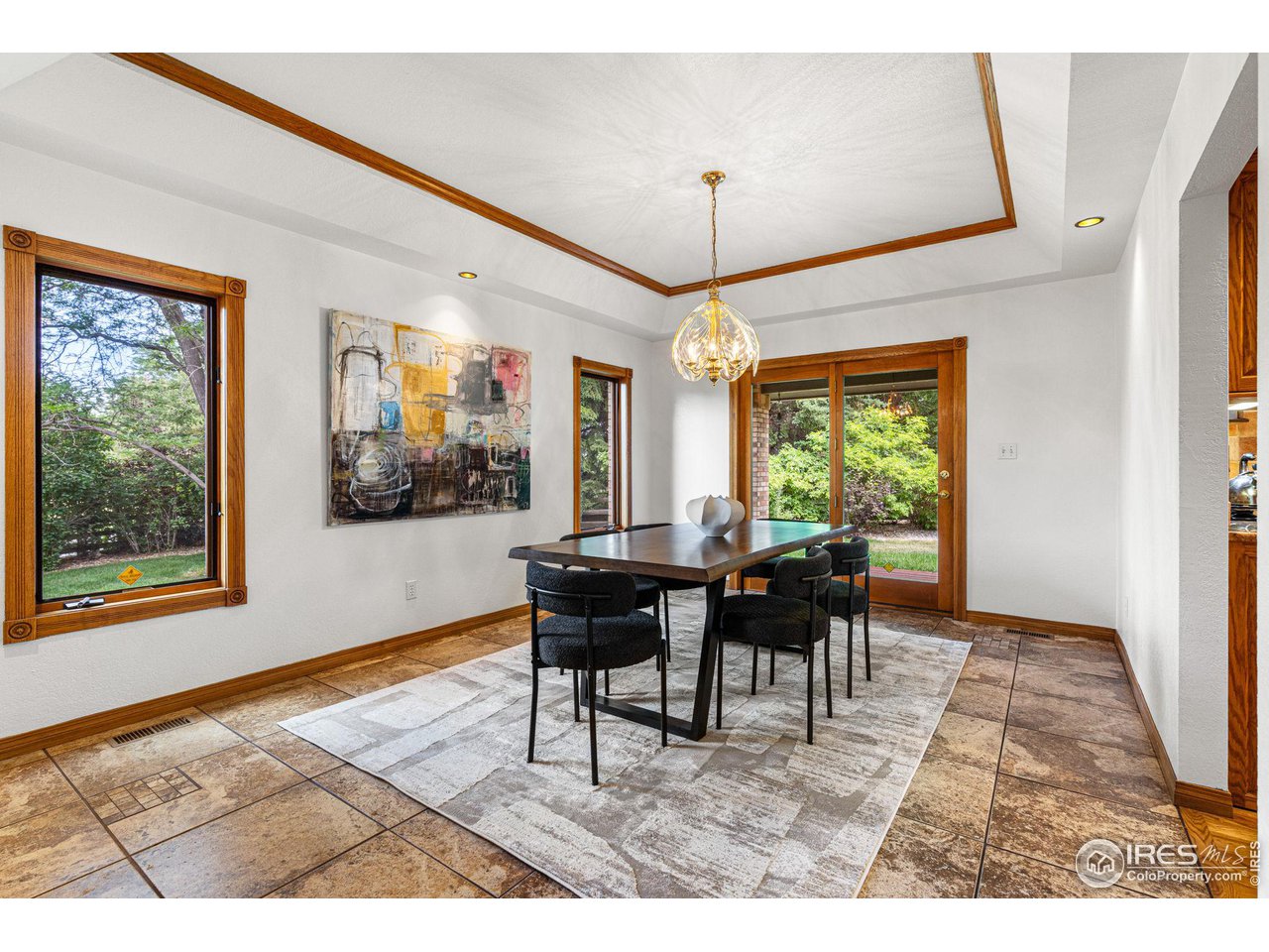 6968 Springhill Drive Niwot, CO 80503 - Photo 6 of 40 a living room with furniture a window and a dining table