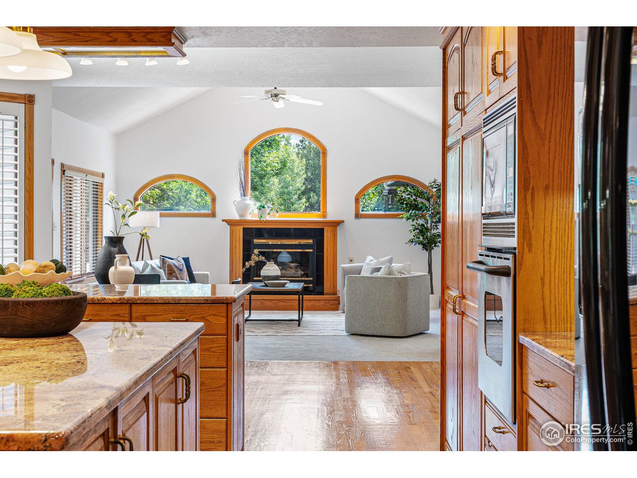 6968 Springhill Drive Niwot, CO 80503 - Photo 9 of 40 a living room with fireplace furniture and a window