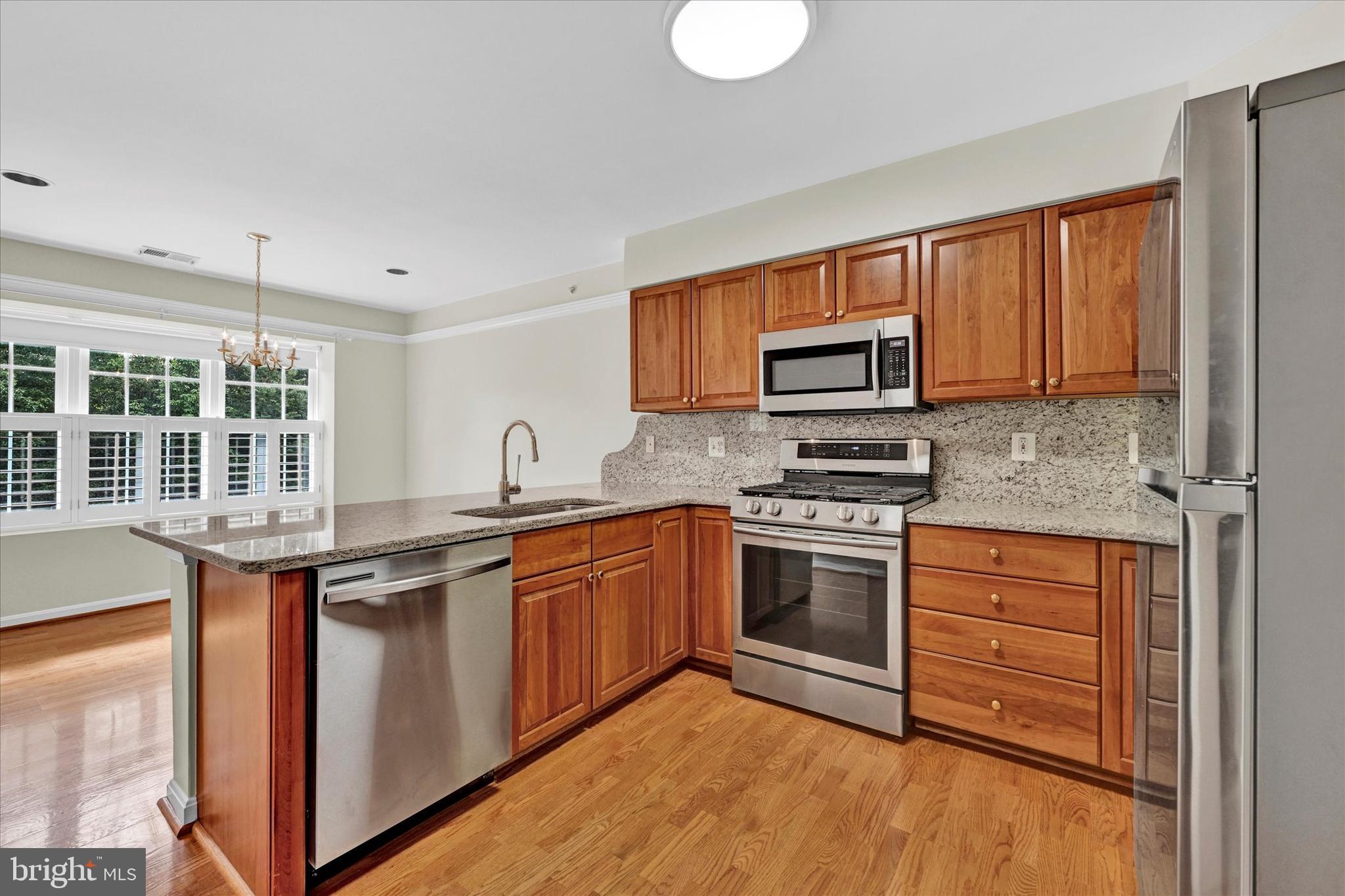 12350 Rosslare Ridge Road, Unit 304 Lutherville-Timonium, MD 21093 - Photo 4 of 27 Updated kitchen with cherry cabinetry...