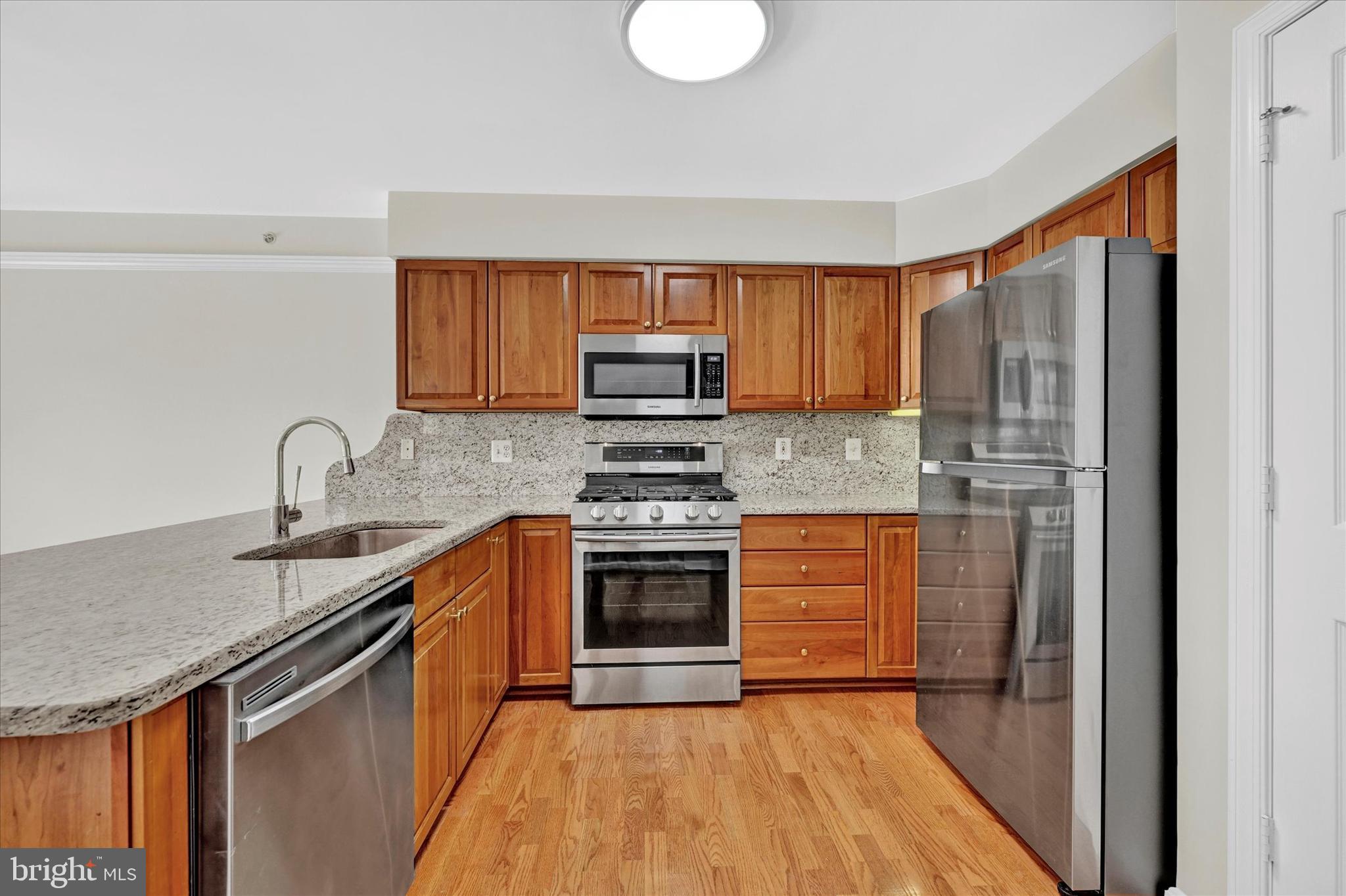 12350 Rosslare Ridge Road, Unit 304 Lutherville-Timonium, MD 21093 - Photo 6 of 27 Updated stainless appliances & laminate flooring.