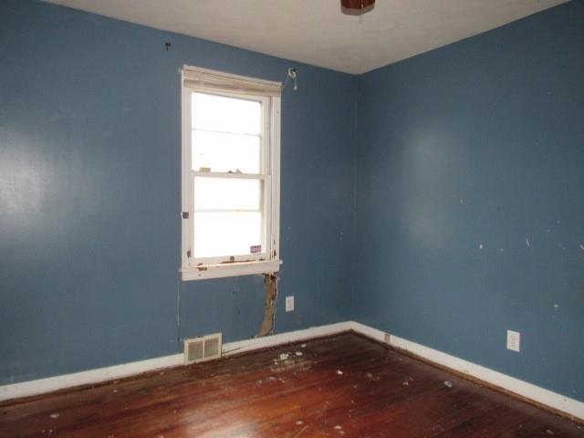 563 Agnew Road Greensburg, PA 15601 - Photo 11 of 16 a view of an empty room with wooden floor and a window