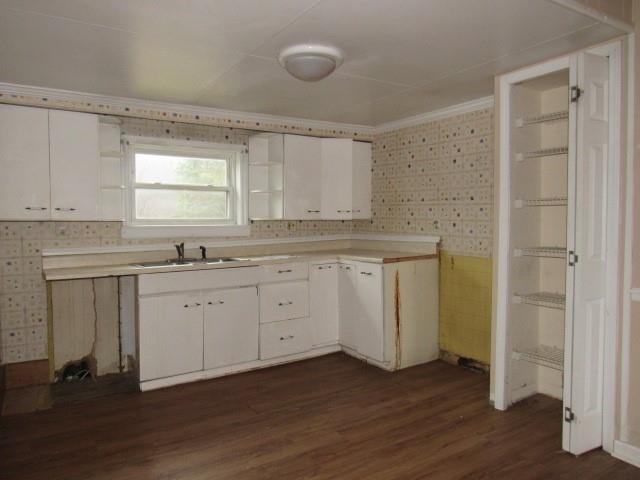 563 Agnew Road Greensburg, PA 15601 - Photo 6 of 16 a kitchen with sink cabinets and wooden floor