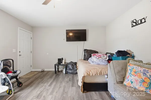 a bedroom with a bed and a couch