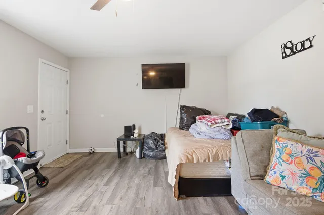 a bedroom with a bed and a couch