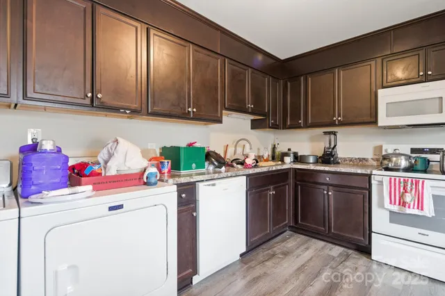 a view of a dining room with furniture wooden floor and a window
