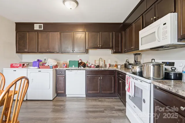 a bedroom with bed and a chandelier