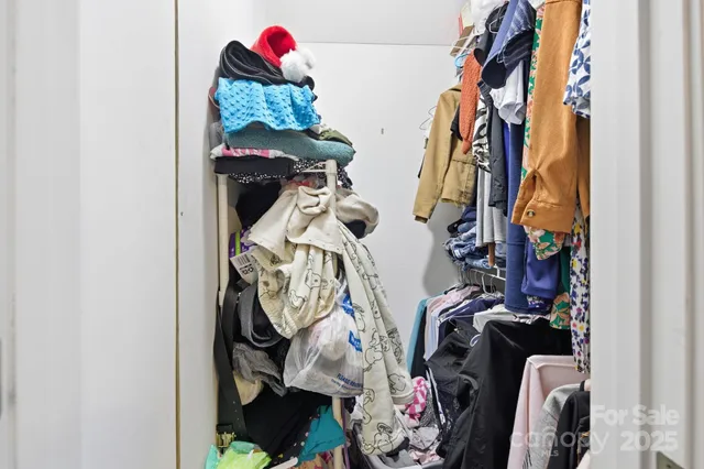 a bathroom with a granite countertop sink and a toilet